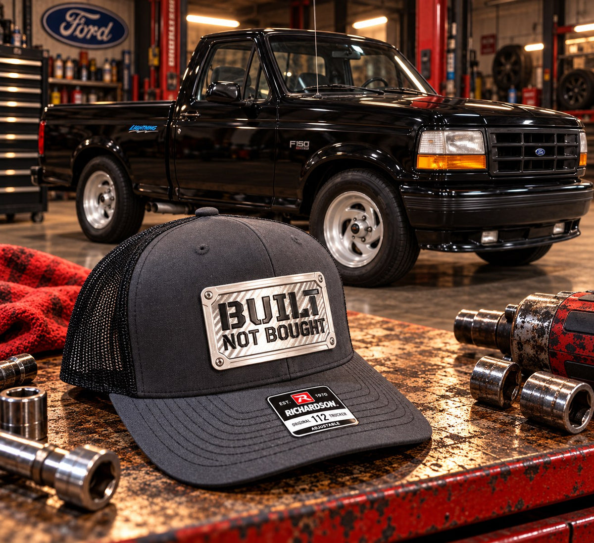 Built Not Bought Richardson 112 hat on a workbench in a garage