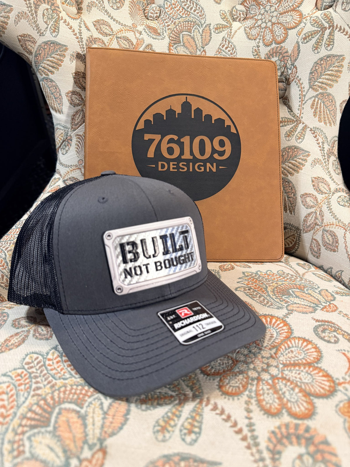Built Not Bought patch on a grey and black Richardson 112 trucker hat