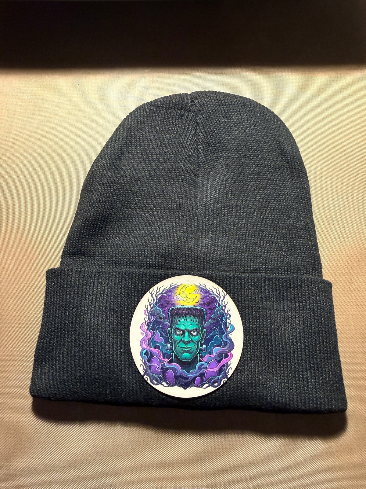 Black cuffed beanie with Frankenstein patch from 76109 Design